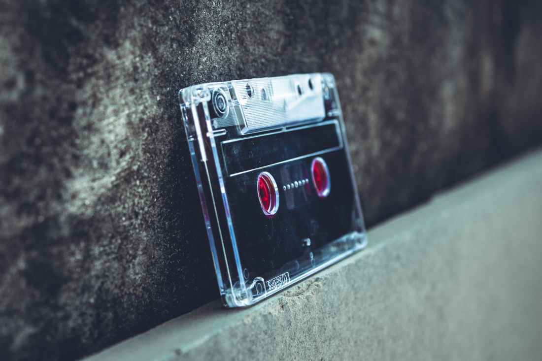 black and gray cassette tape leaned on wall